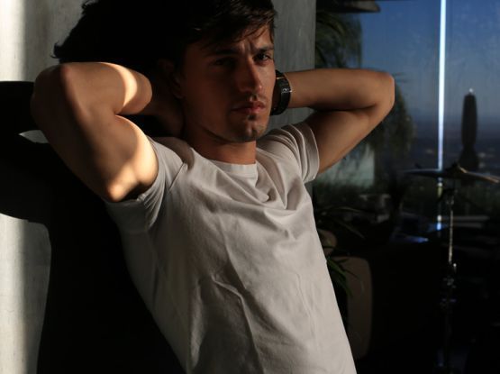 Asher Monroe wearing a t-shirt with his armpits exposed