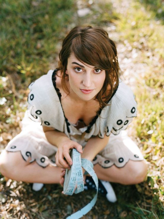 Sara Bareilles holding tickets