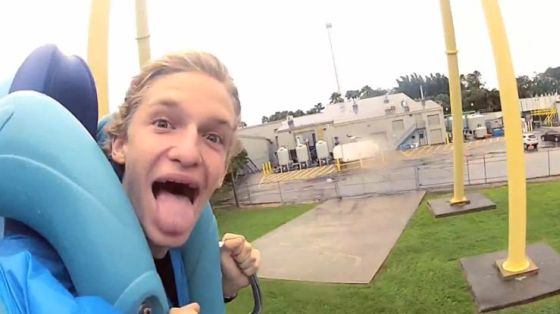 Cody Simpson sticks out his tongue while riding the Kraken roller coaster at SeaWorld in Orlando, Florida