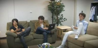 Joe, Nick and Kevin Jonas of the Jonas Brothers, seen here sitting on the couch, talk about going shirtless for a scene in 'Jonas Brothers: The 3D Concert Experience'