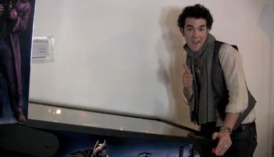 Kevin Jonas of the Jonas Brothers, seen here playing pinball and giving the thumbs up, talked with Popstar! magazine about the performance around the campfire on 'Camp Rock 2'