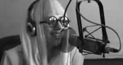 Lady Gaga, seen here wearing eyeglasses during a radio interview, talks about Christmas