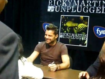 Ricky Martin signs autographs at FYE during a meet and greet in New York City