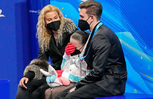 Kamila Valieva and her coaches react to a disappointing skate in the women’s fig... - Robert Deutsch, USA TODAY Sports