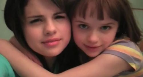 Selena Gomez holding big screen baby sister